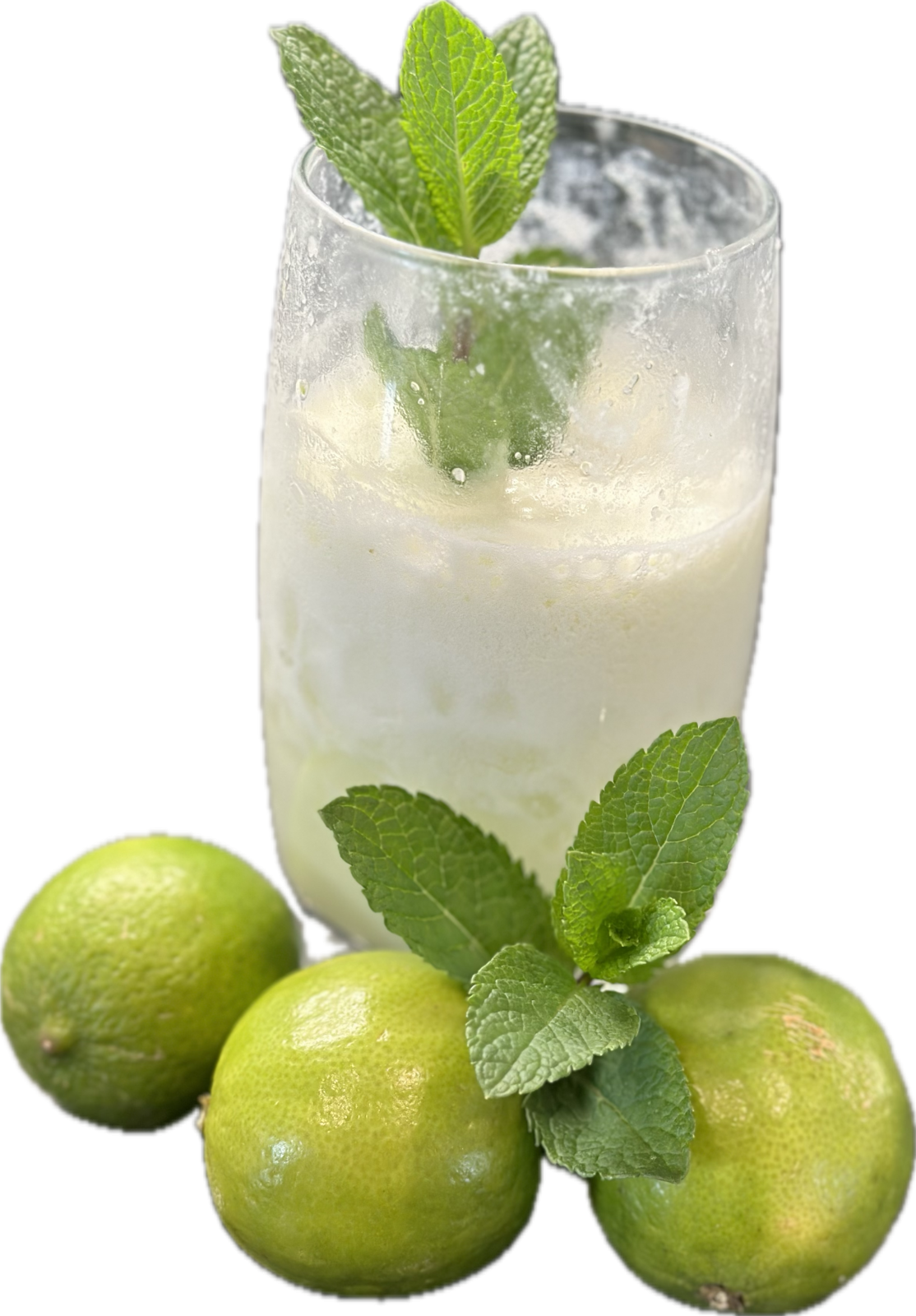 A tall glass of creamy mint limeade served over crushed ice with a sprig of mint.