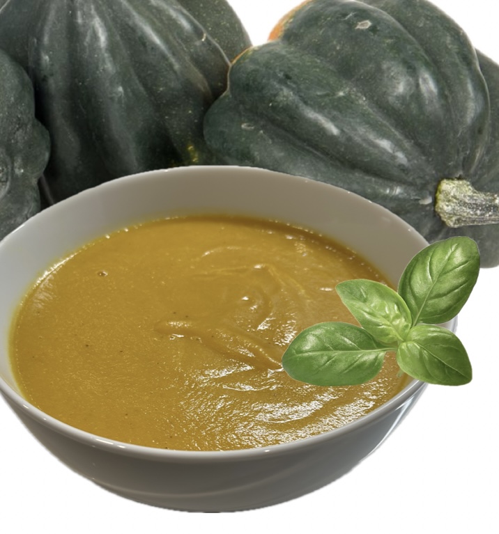 A warm bowl of golden acorn squash soup with turmeric and curry.
